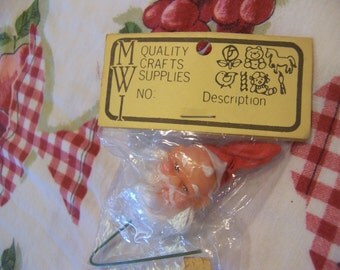 tiny rubber santa head