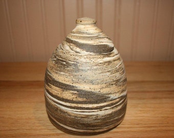 Amazing multicolored clay covered jar, lidded jar