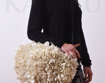 cream and black felt bag woven handles and shoulder strap