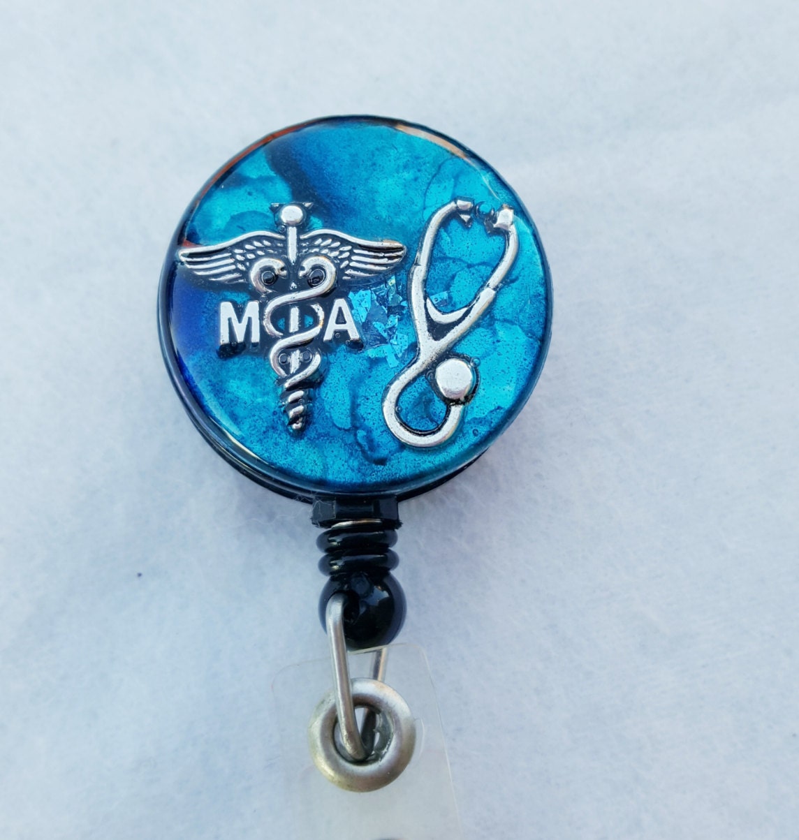 Medical Assistant name badge holder with a teal/blue