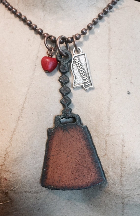 Items similar to COWBELL MISSISSIPPI necklace with faux red heart made