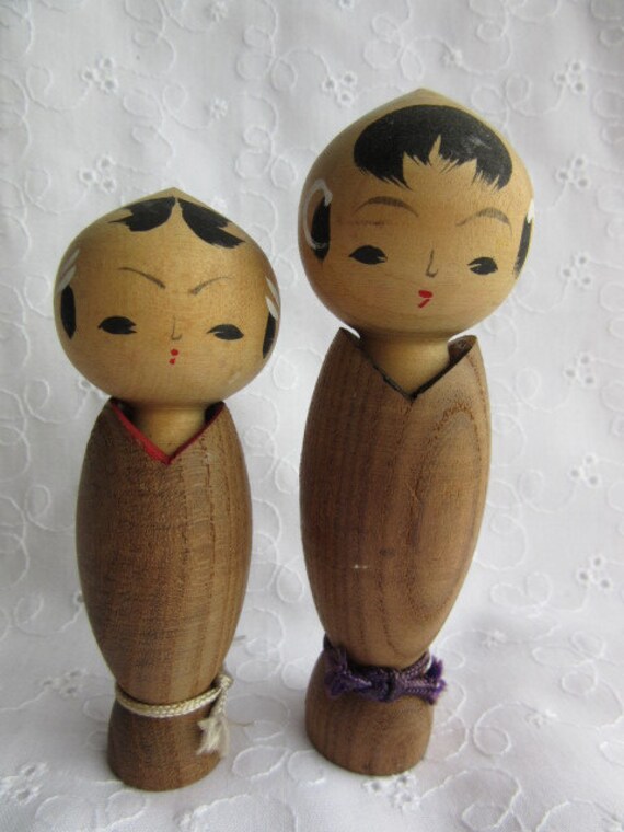 A pair of Kokeshi dolls vintage Japanese wooden dolls
