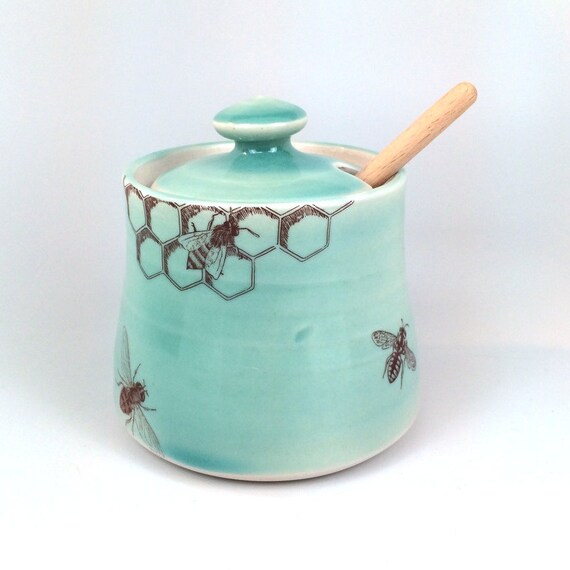 Green celadon glazed porcelain honey pot with bees buzzing and