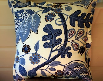 Beautiful blue and white upholstery fabric cushion with hand embroidered detail
