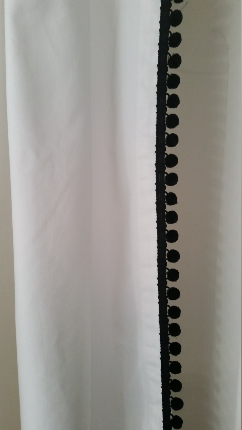 Classic white cotton shower curtain with black ball fringe