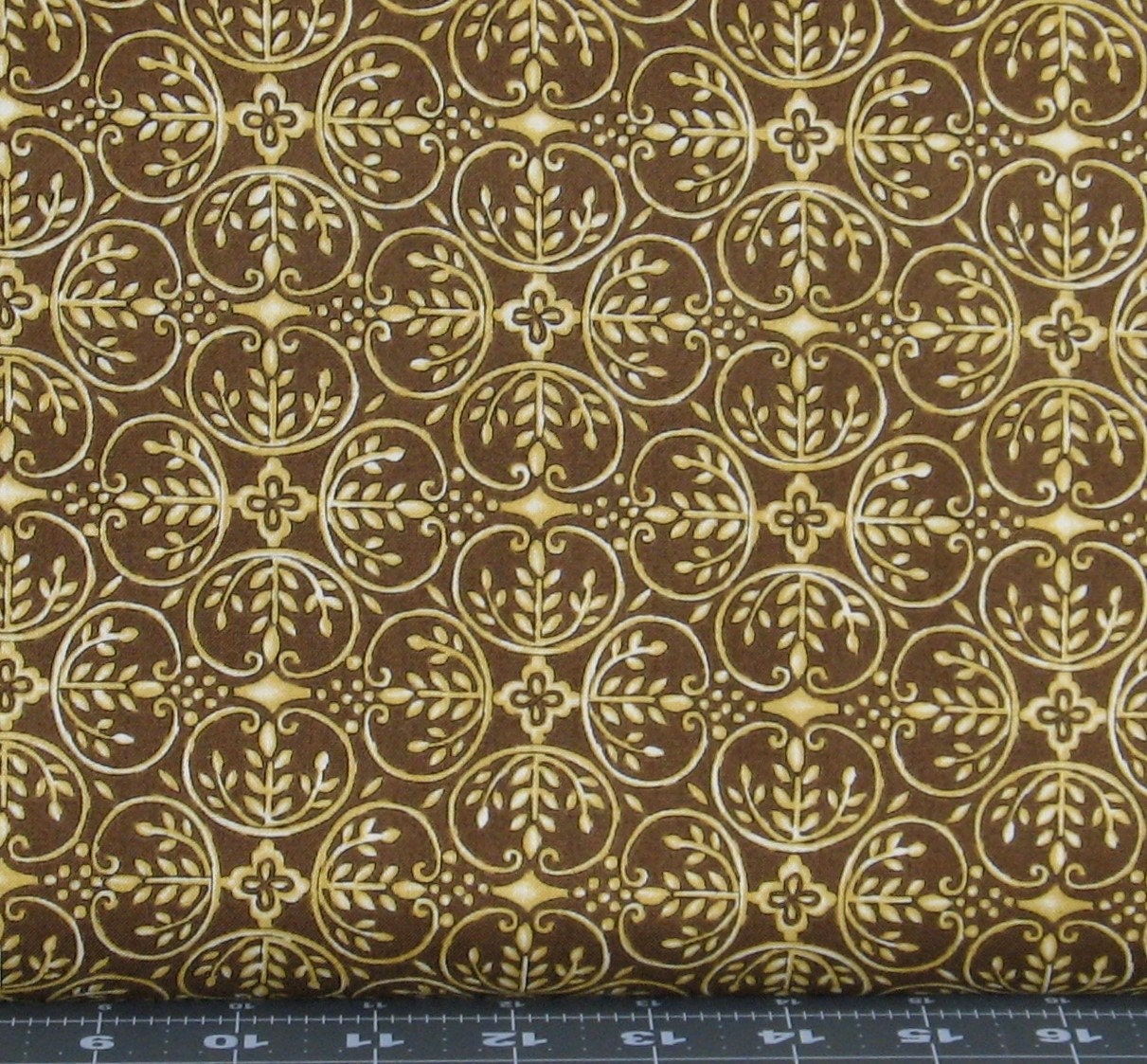 Gold Design on Brown Cotton Quilt Fabric for Sale