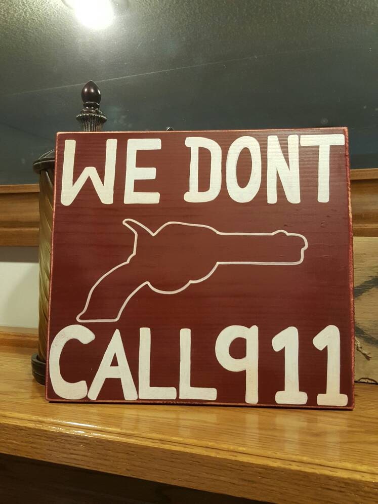 We Don't Call 911 Wood sign