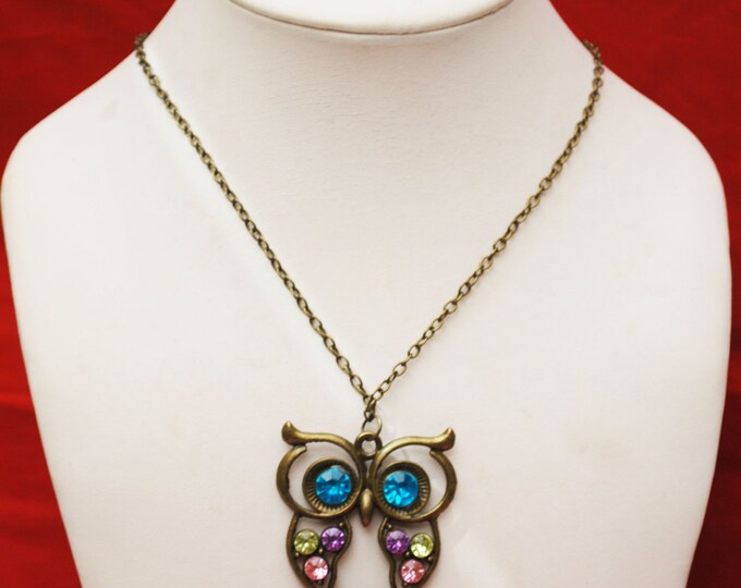 Rhinestone Owl Necklace of a brassy bronze metal and colorful stones