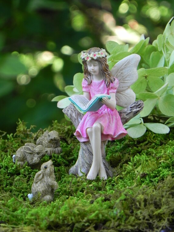 fairy reading a book statue