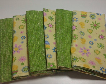 EASTER yellow with cute flowers & chicks will make your table shine. Set of 6, back side is green pattern which compliments the front.