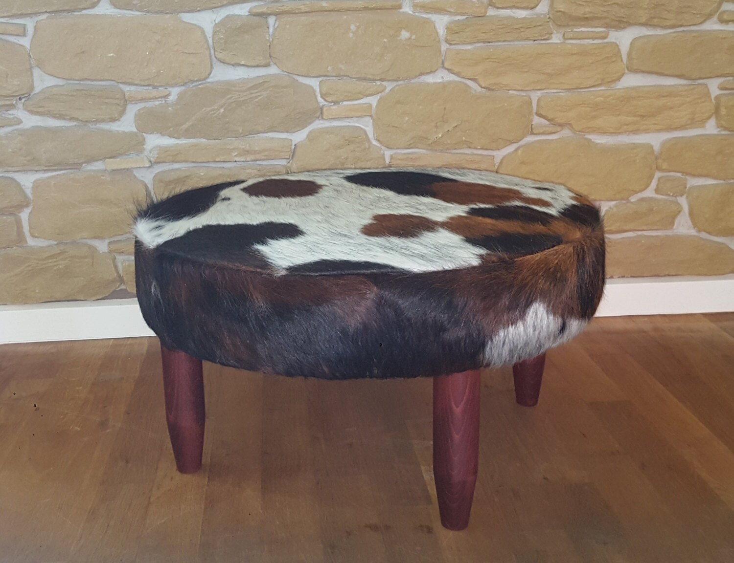 round cowhide footstool ottoman available now
