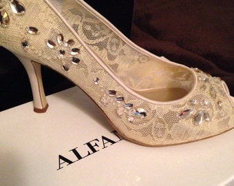 Cream Wedding Shoes worn once, size 7.5, peep toe.