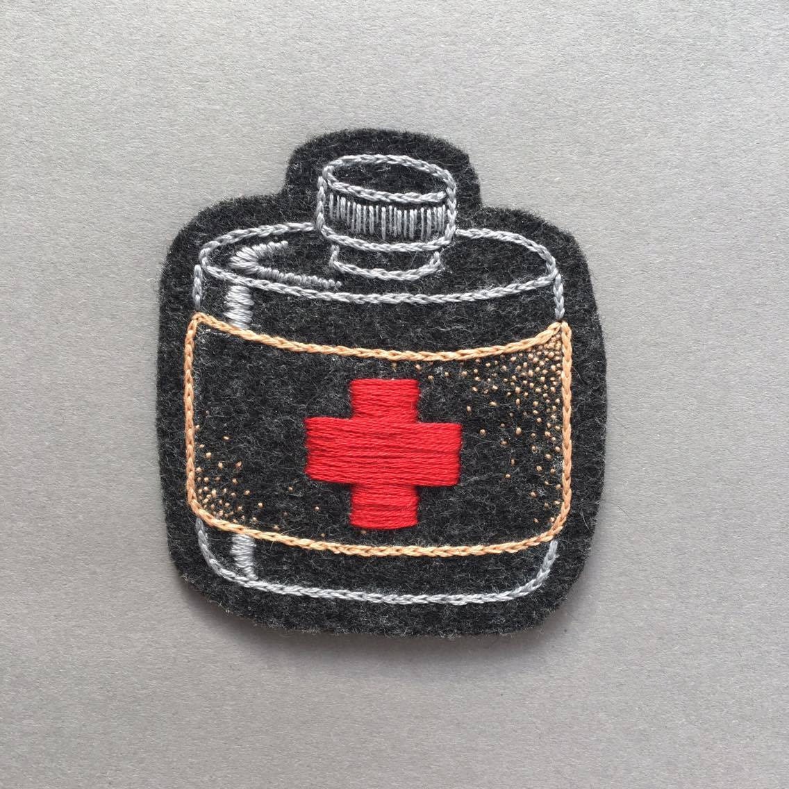 Hand embroidered medicine bottle patch