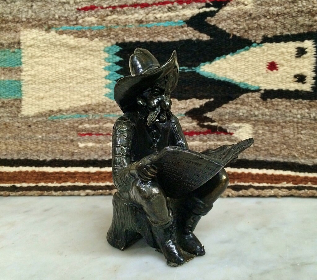 ViNTAGE BrONZE COWBOY StATUE ReADING the PHOENIX GAZETTE