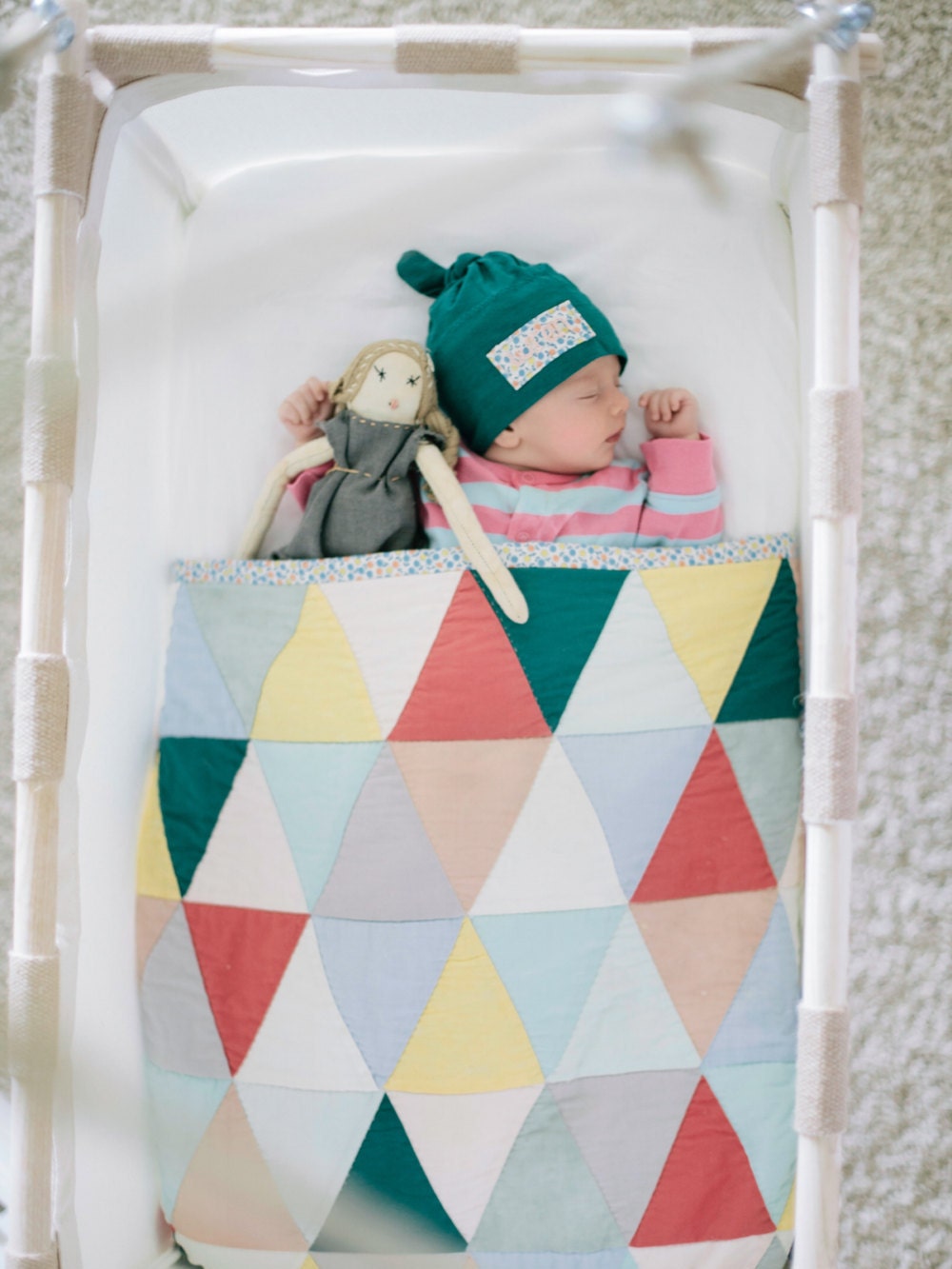 Hanging baby cradle on a spring from natural materials and