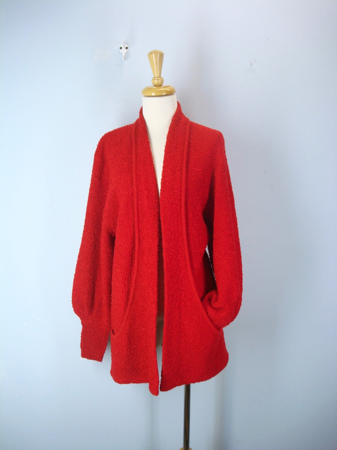 red cardigan sweater with pockets jeans