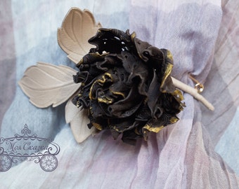 Leather flower. Sprig of rose.