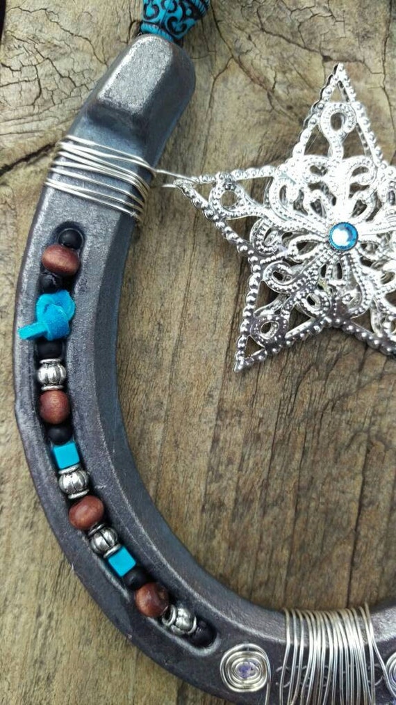 Silver and turquoise horseshoe picture frame with large silver
