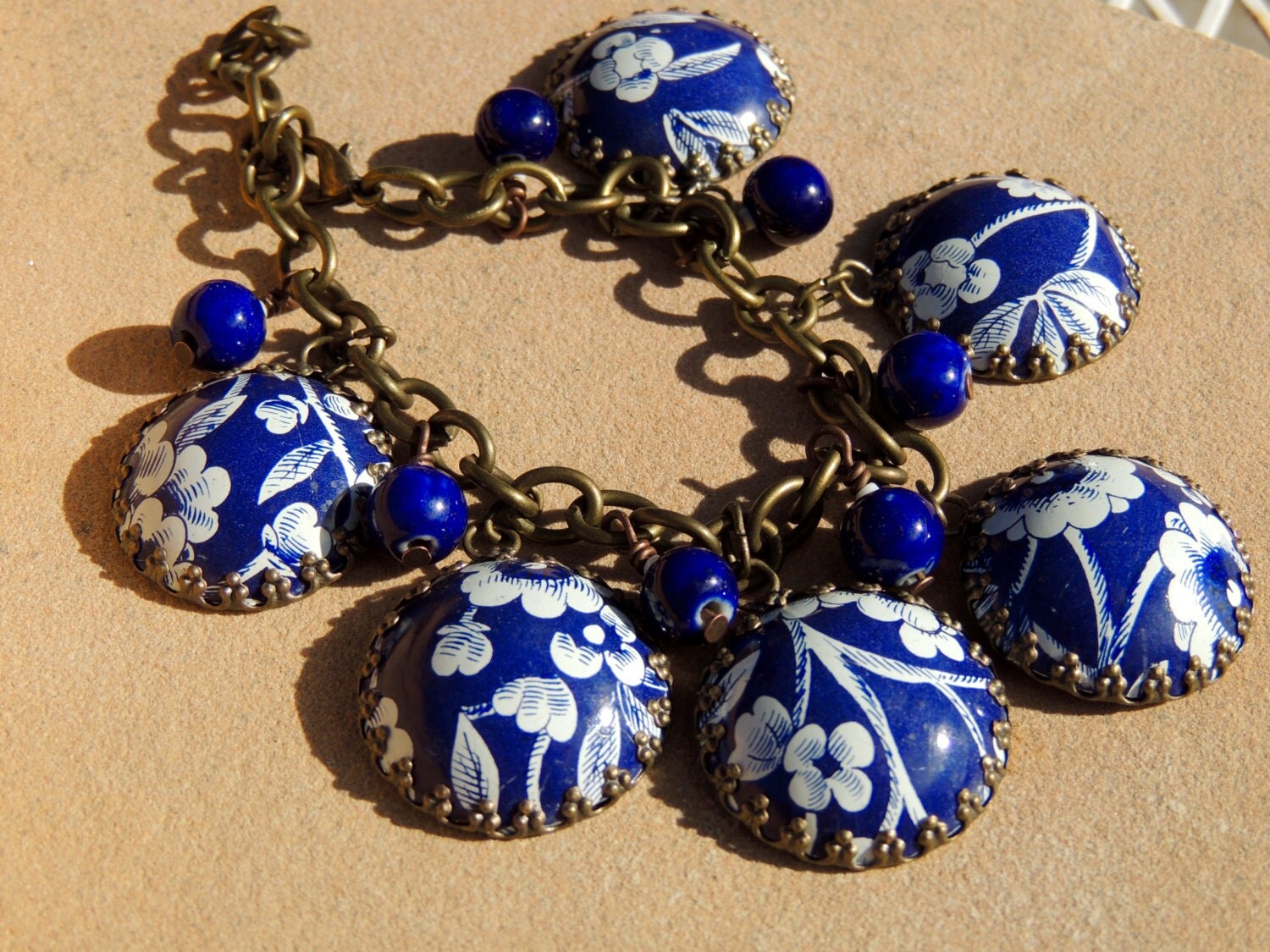 tin charm bracelet blue and white vintage tin tin jewelry