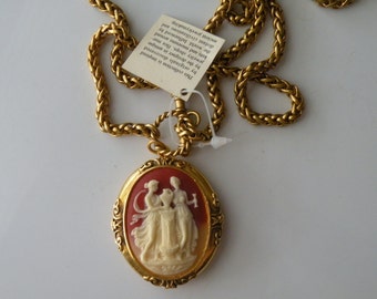 Cameo locket pendant necklace. Gold plated chain