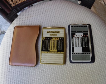 Vintage Addiator Duplex - & Addimult Sumax-6 Mechanical hand calculators in cases with metal wands 1950s