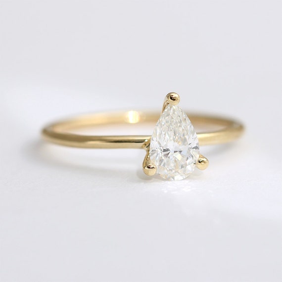 simple solitaire pear shape engagement rings