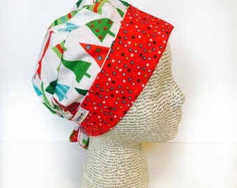 Tie Back Surgical Scrub Cap featuring a white material with re green and blue Christmas trees and a coordinating band