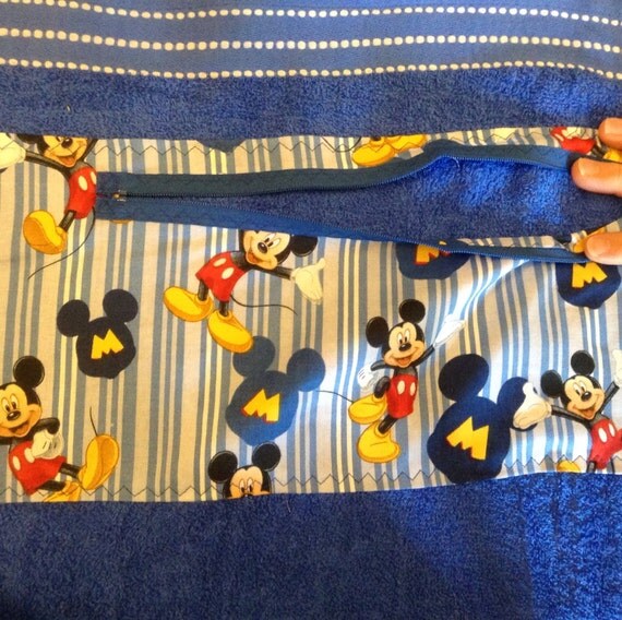 Beach towel with zippered pocket