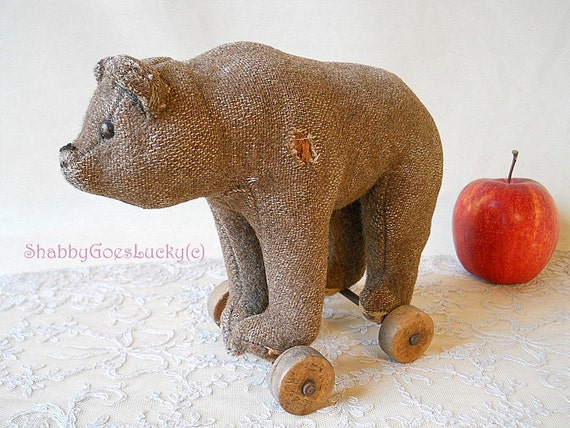 Antique Steiff bear standing on wheels