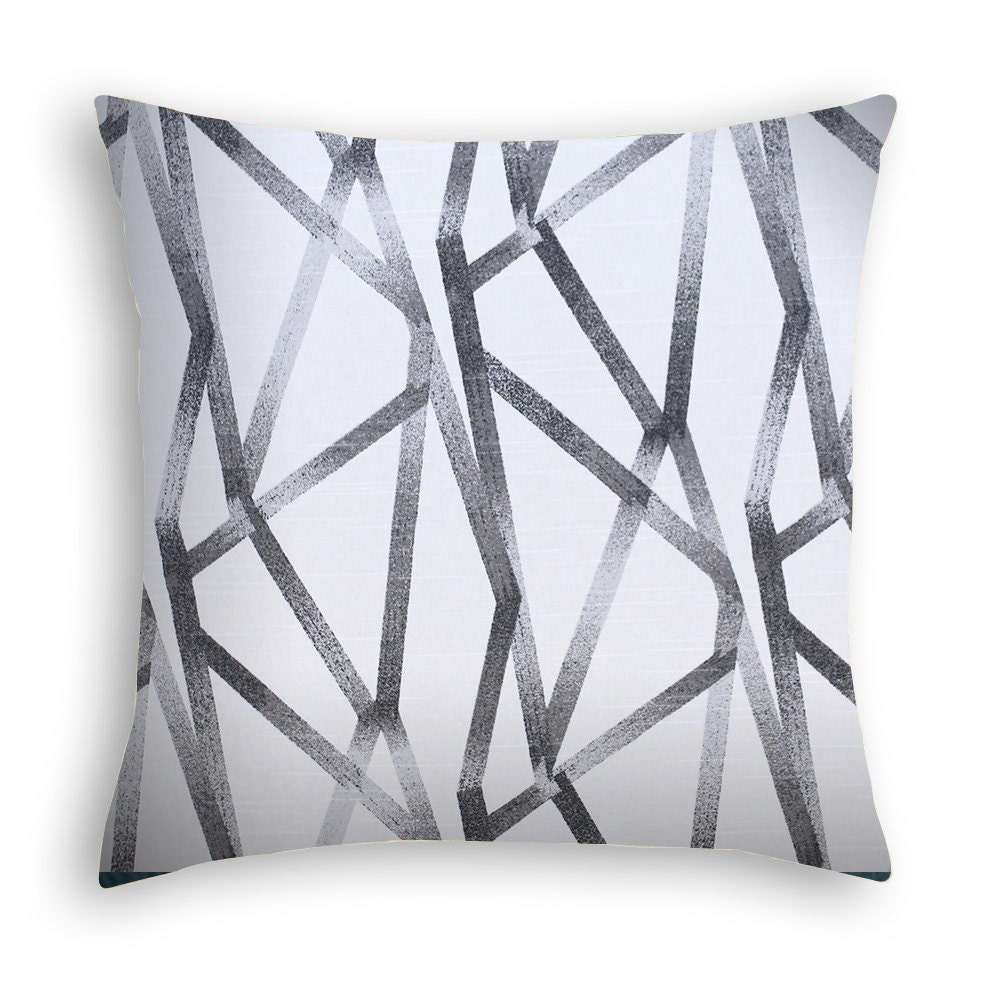 Neutral geometric print throw pillow. Dark grey on a creamy
