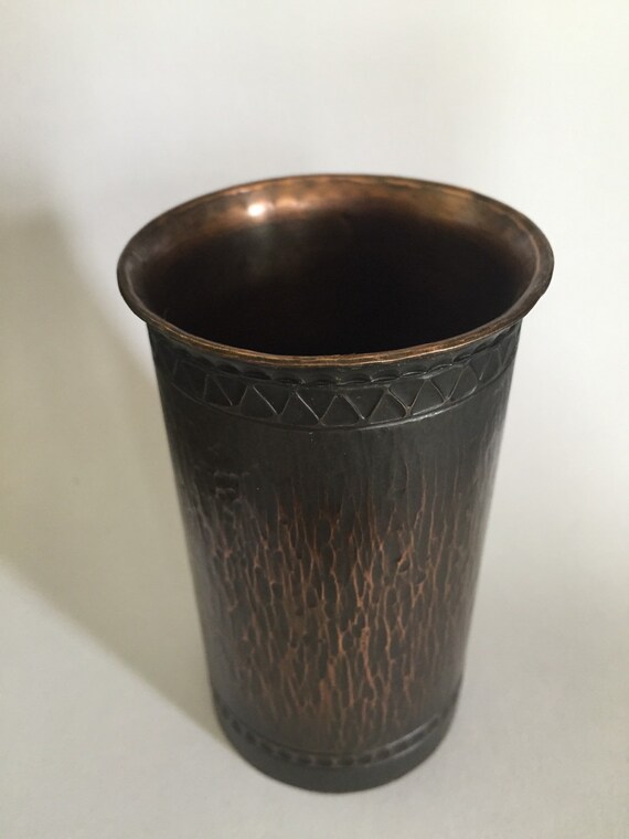 Small solid copper vase.