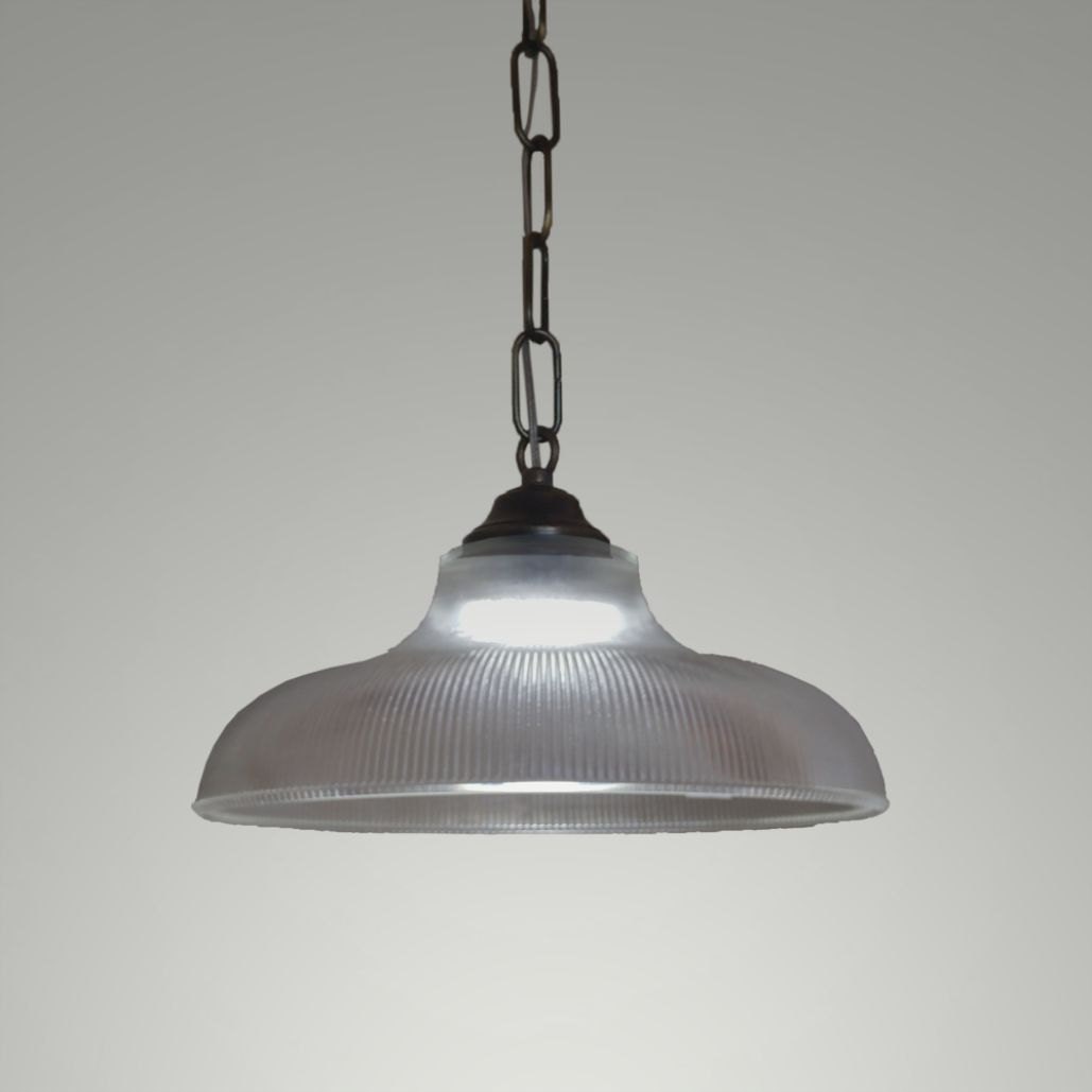 Large glass pendant lighting on a brass chain. Hanging large