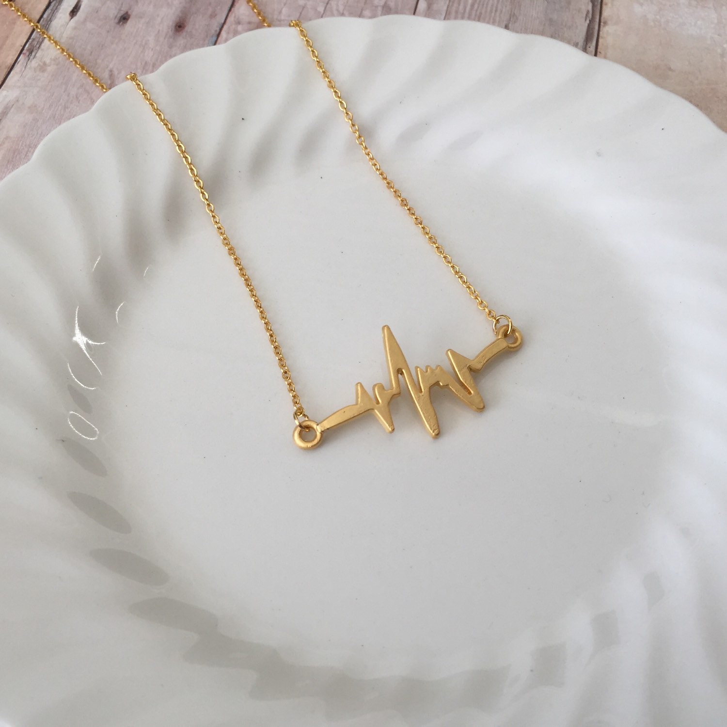 gold studded heartbeat necklace