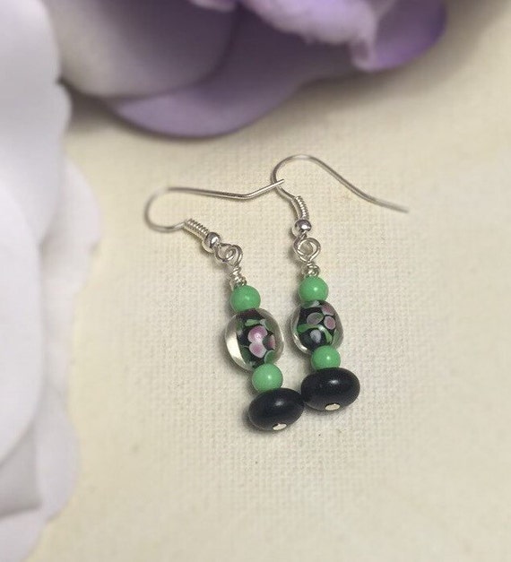 Items similar to Black & Green Floral earrings on Etsy