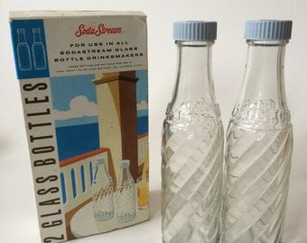 Two original boxed SodaStream bottles