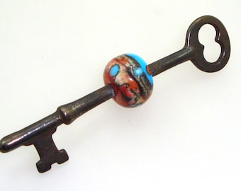 Handmade Lampwork Glass Bead - Beaded skeleton key. Silvered ivory, dots, on coral & turquoise. Southwestern, vintage, steampunk, pendant.