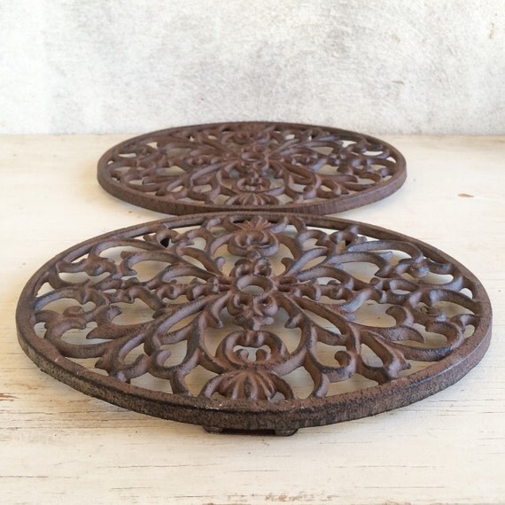 Pair of vintage 91/2 cast iron trivets wall hangings
