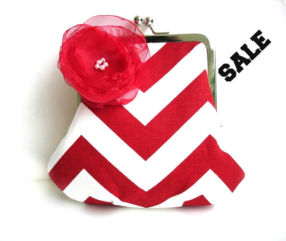 red and white clutch bag