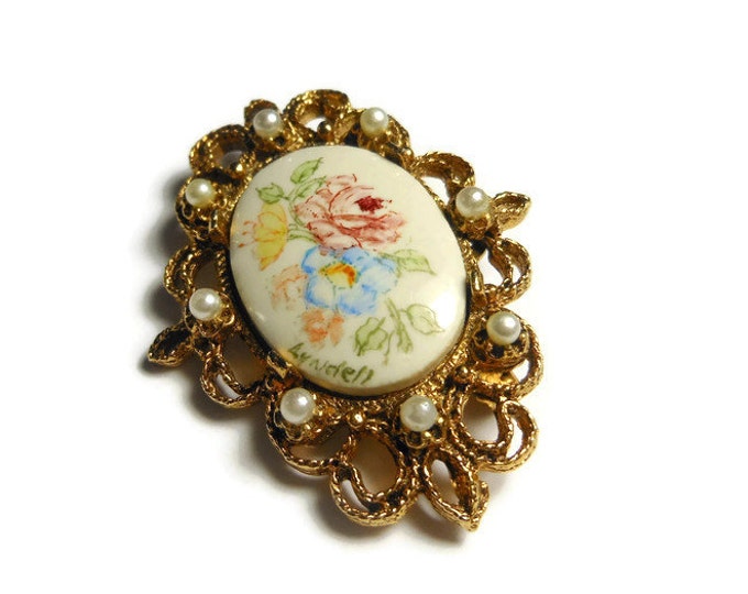 Floral hand painted brooch pink roses and yellow and blue flowers with gold filigree open work frame with seed pearls, signed Lyndell