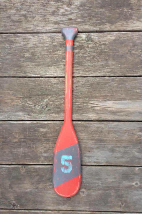 21 inch long miniature canoe paddles hand crafted out of pine.