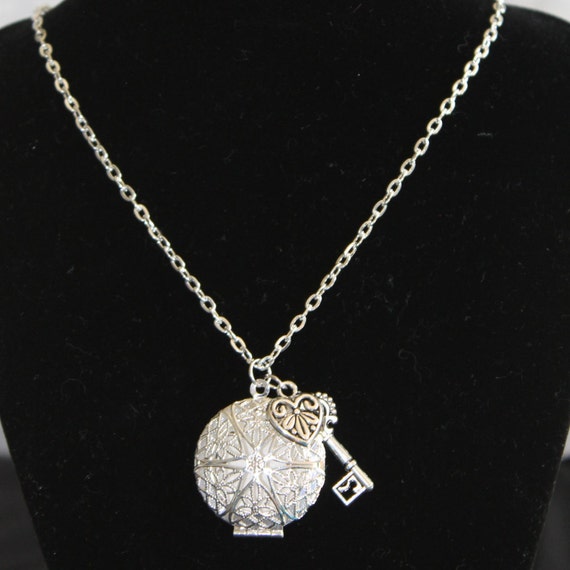 Items similar to Aromatherapy Diffuser Necklace with Charms (Silver) w