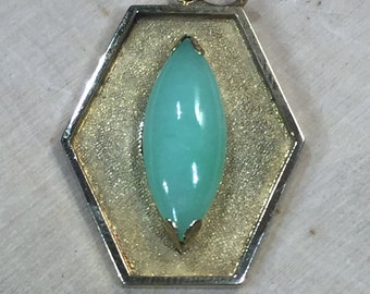 14kt Gold Pendant with Oval shape Jade in the center