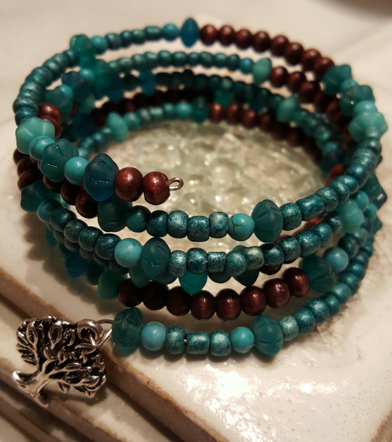 Teal glass beads and brown wood beads on by TinasSunshineBeads