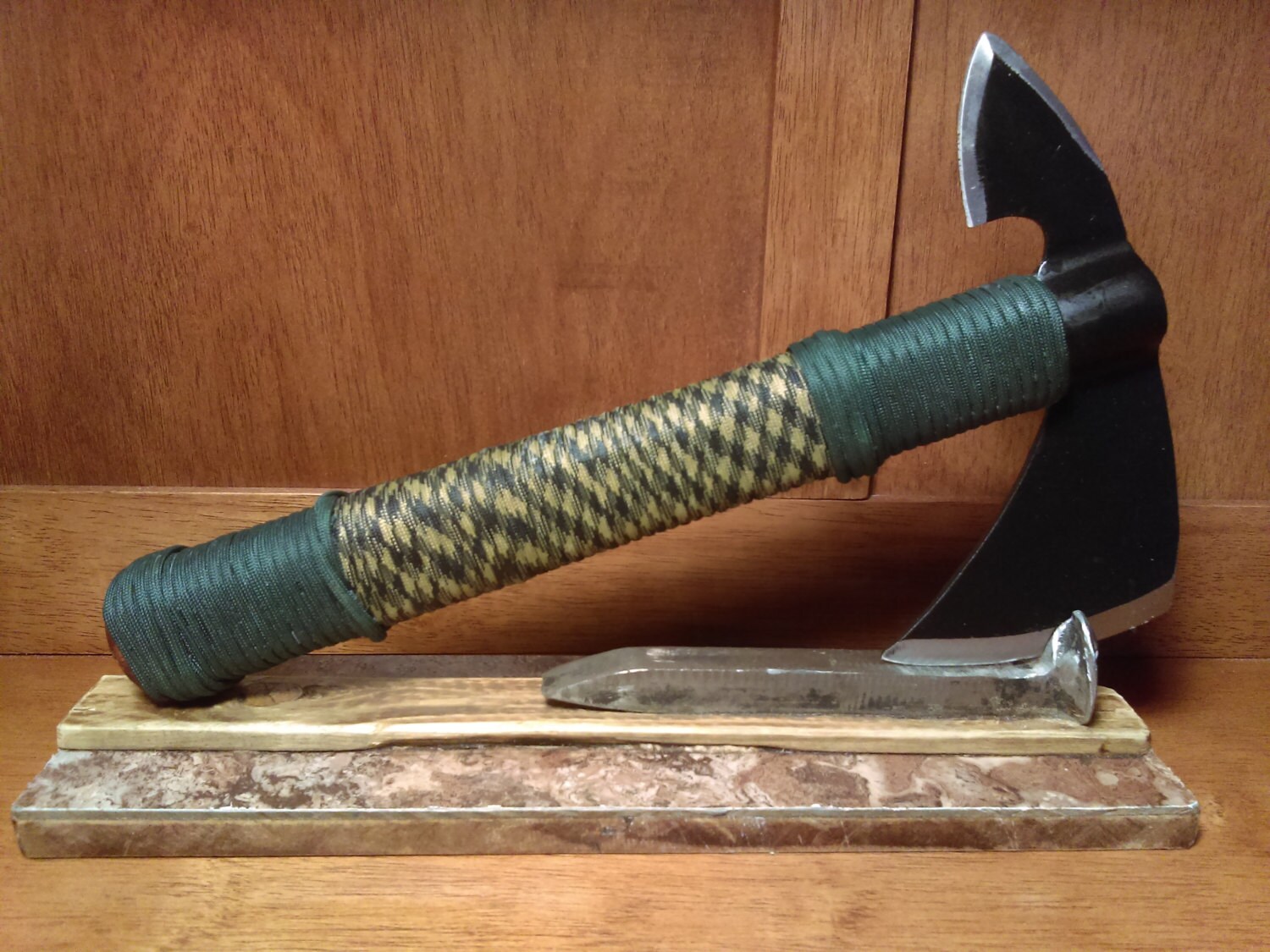 67 ParacordWrapped Tomahawk on Mounted Railroad Spike Stand