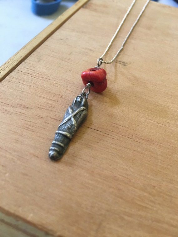 fine silver corn goddess with coral; chain length 16 inches