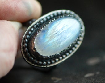 handcrafted moonstone ring set in darkened sterling silver, size 8.75, oval stone, rainbow moonstone