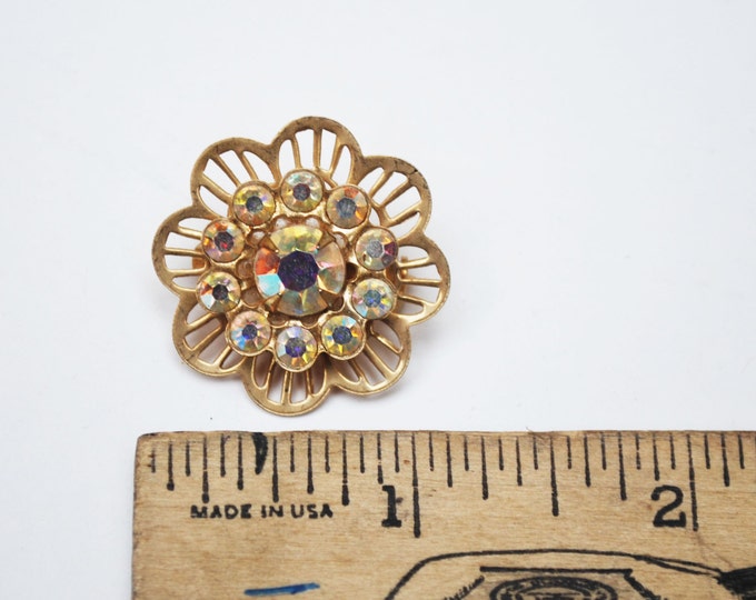 Rhinestone Flower Brooch Aurora Borealis Gold tone metal Mid century Pin