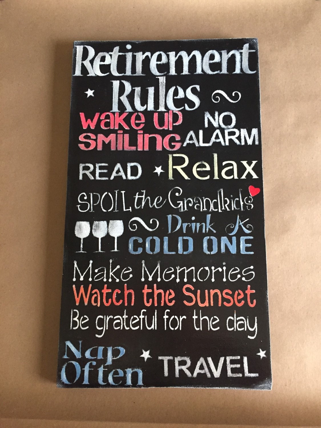 Retirement rules 12x20 stained wood with stenciled lettering.