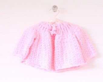 Vintage baby sweater, pink knit with tie at collar, size about 0-3 months