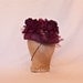 Plum/purple occasion hat decorated with rose, tulle and beading